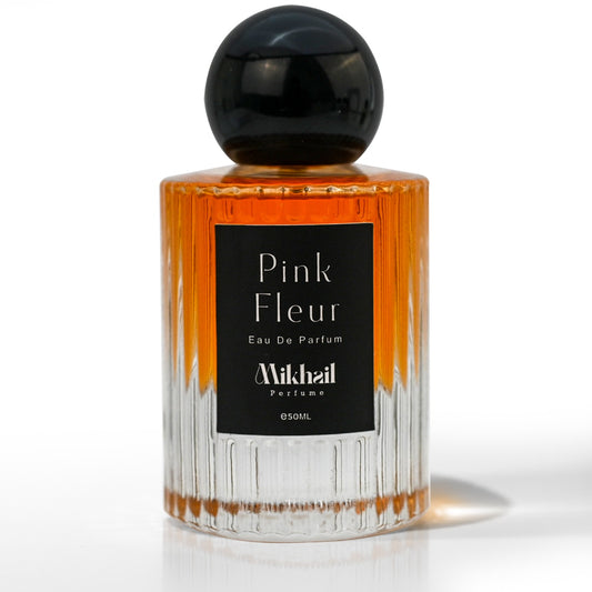 Pink Fleur by Mikhail EDP, Long Lasting, for women, elegant perfume bottle featuring green lilac, Sicilian lemon, peach blossom, red peony, and amber musk. Manufactured in UAE